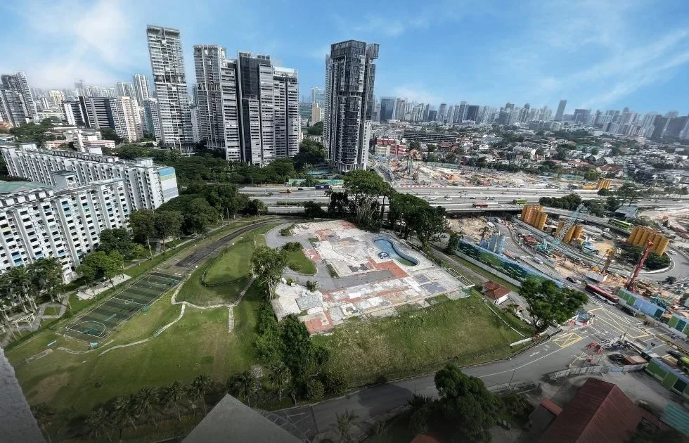 Aerial view of the 8 Thomson Lane site today, beside the Pan-Island Expressway with the Singapore skyline and surrounding high-rise developments in the background